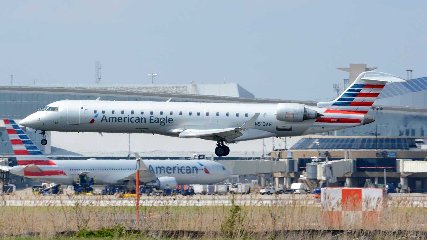 An American Eagle CRJ700 operated by PSA Airlines lands at Philadelphia International Airport