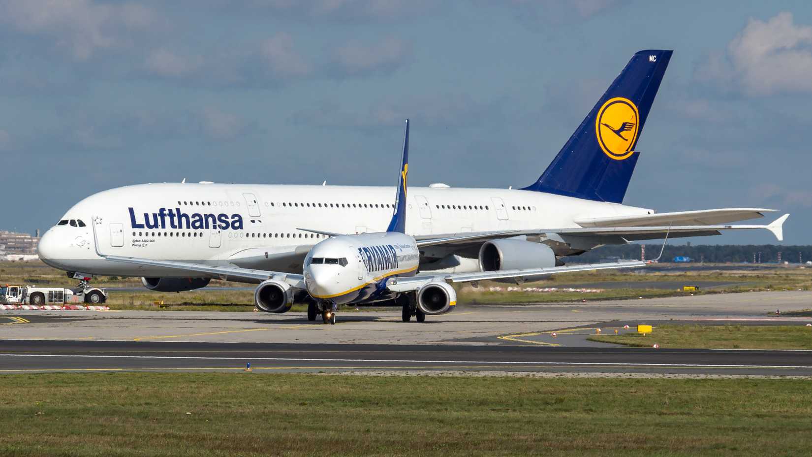 Lufthansa A380 towers over a Ryanair 737