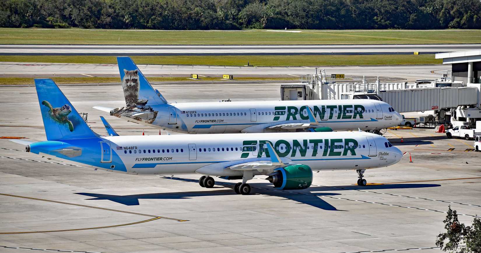 pair of Frontier Airlines Airbus airplanes, an A321-200 (N720FR) and an A321neo (N648FR) at Tampa International Airport (TPA)