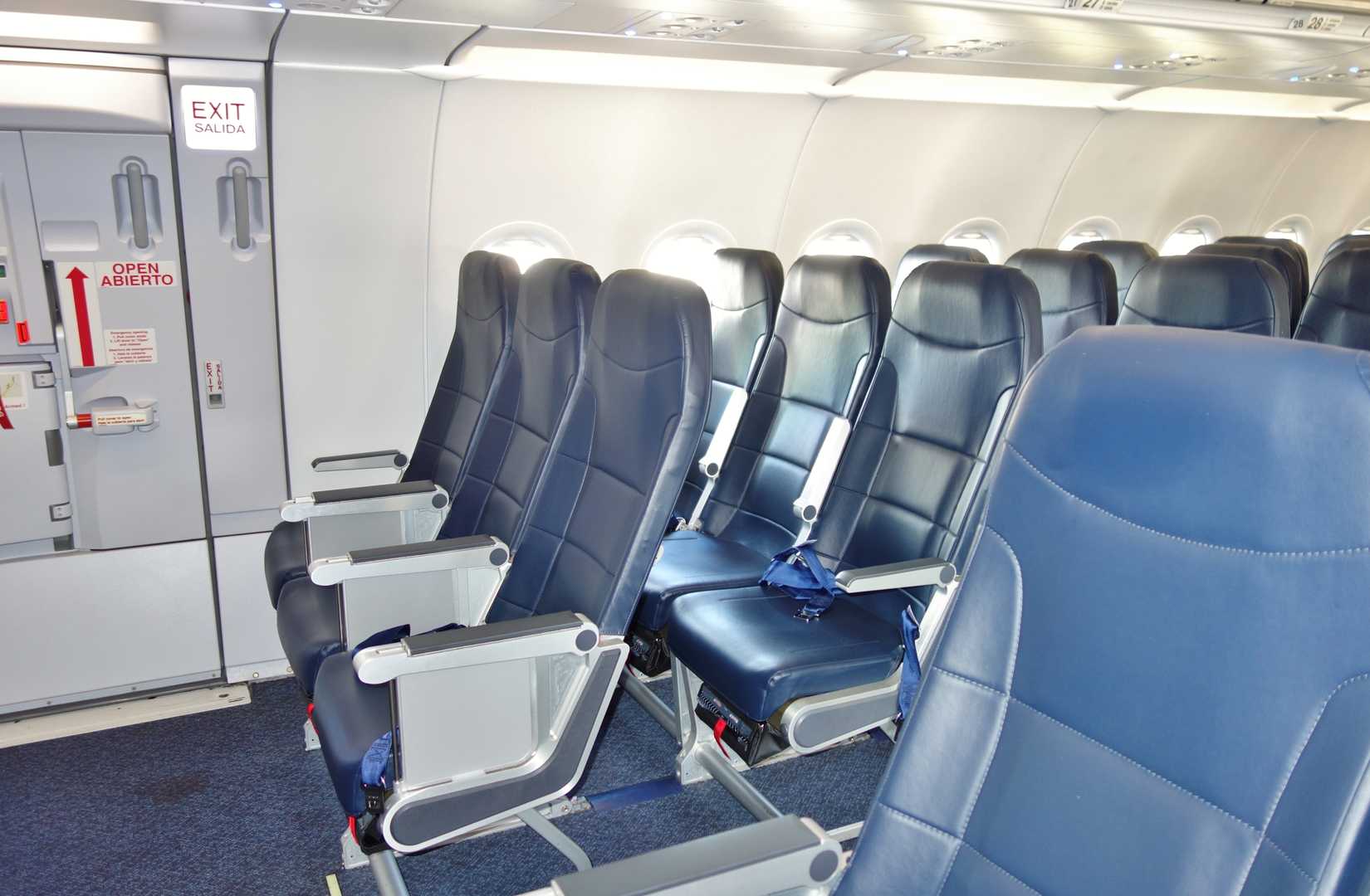 Inside cabin view of Deluxe Leather seats inside an Airbus A321 airplane from low-cost airline Spirit (NK)