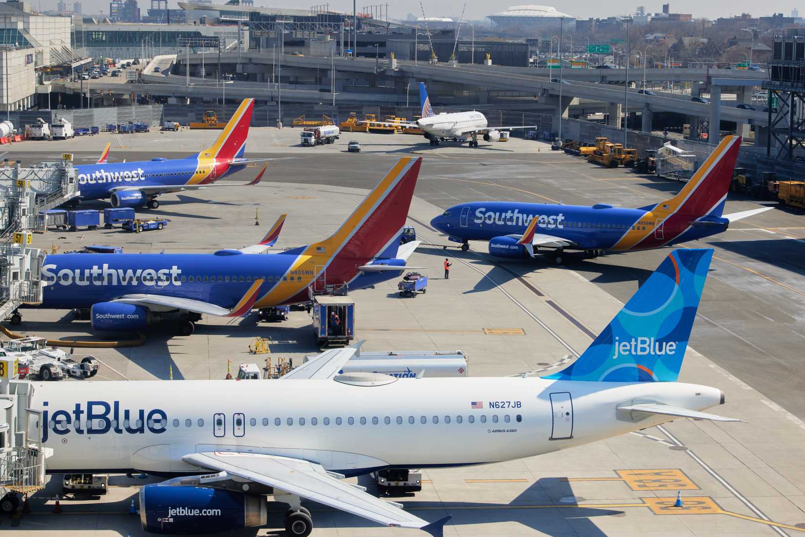 Southwest Airlines and jetBlue planes await their next flight at LaGuardia Airport 
