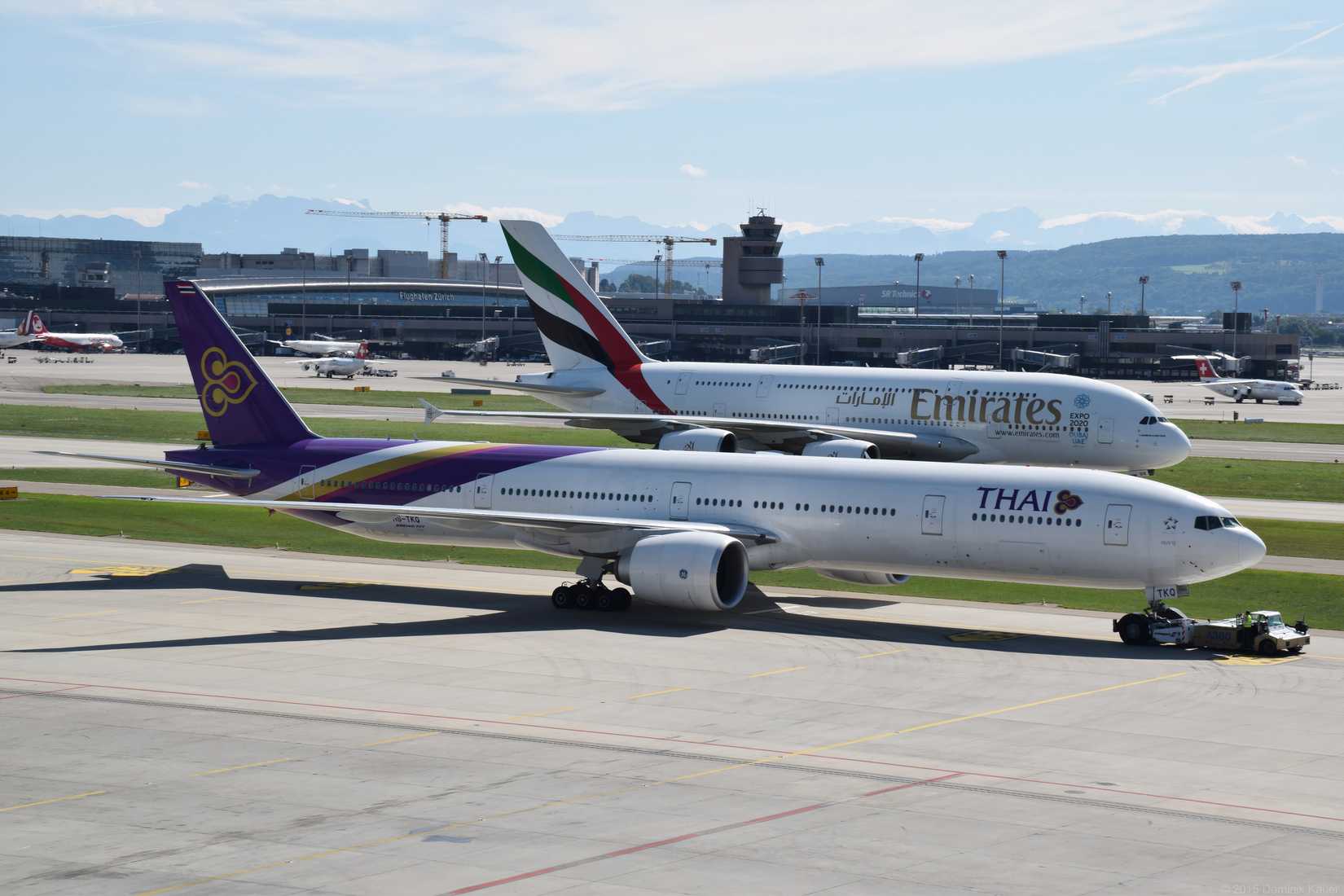 Thai Airways Boeing 777-3ALER and Emirates Airbus A380-841.Two beauties, one picture