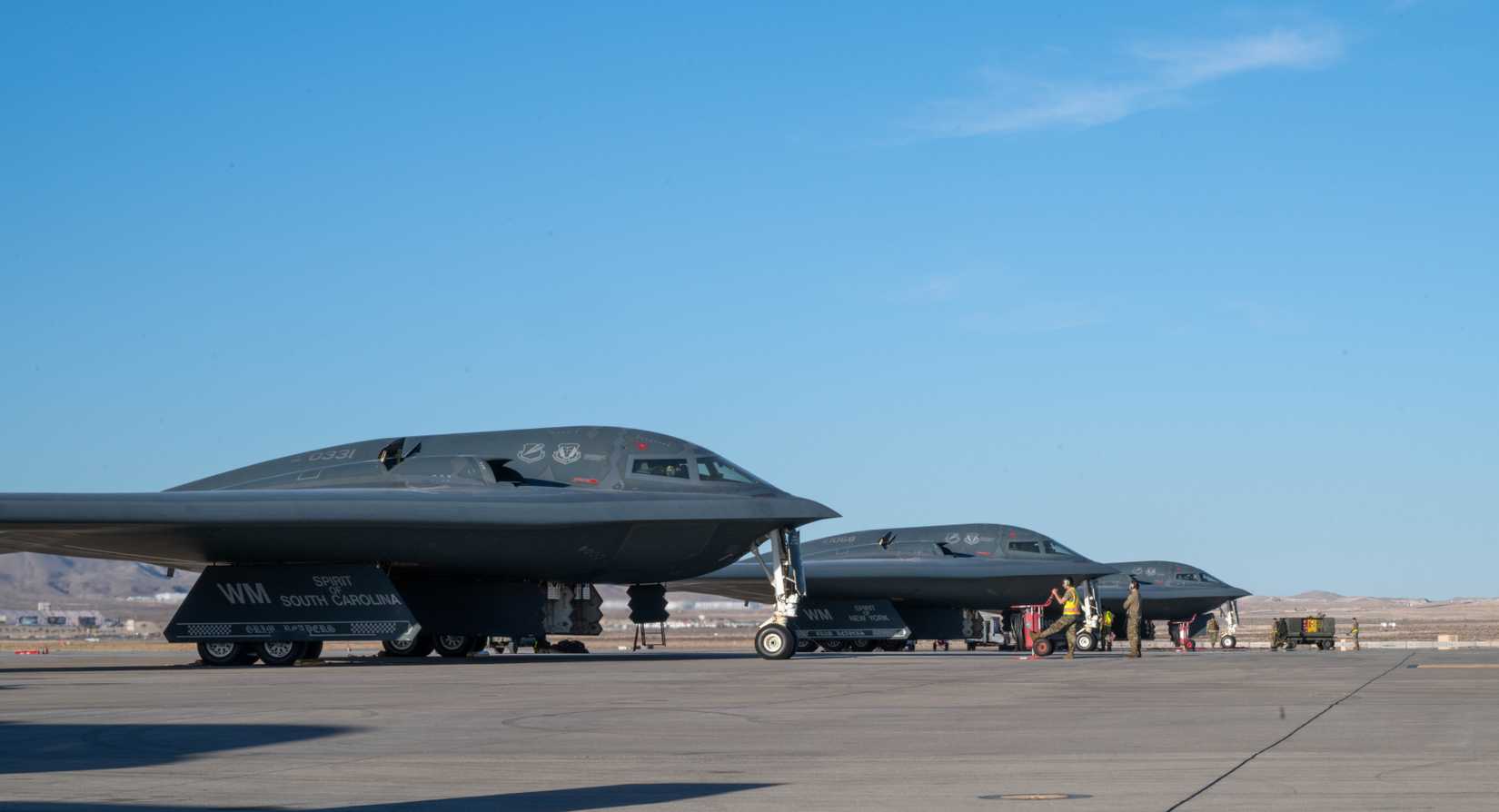 Three B-2 Spirit stealth bombers prepare for departure during Exercise Bamboo Eagle at Nellis Air Force Base, Nevada, Feb. 10, 2025.