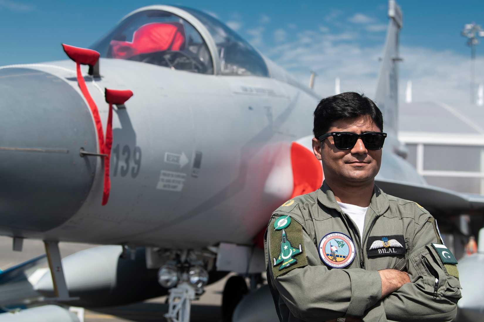 A Pakistani Airman poses in front of a JF-17 Thunder.