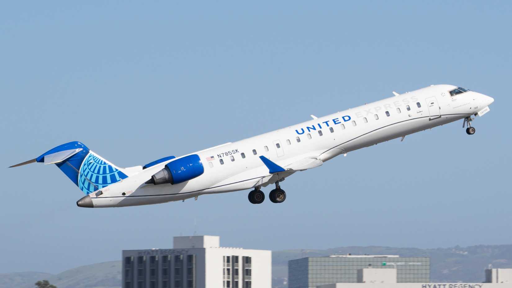 A United Express CRJ 700 departing John Wayne Airport. This plane is operated by SkyWest Airlines.