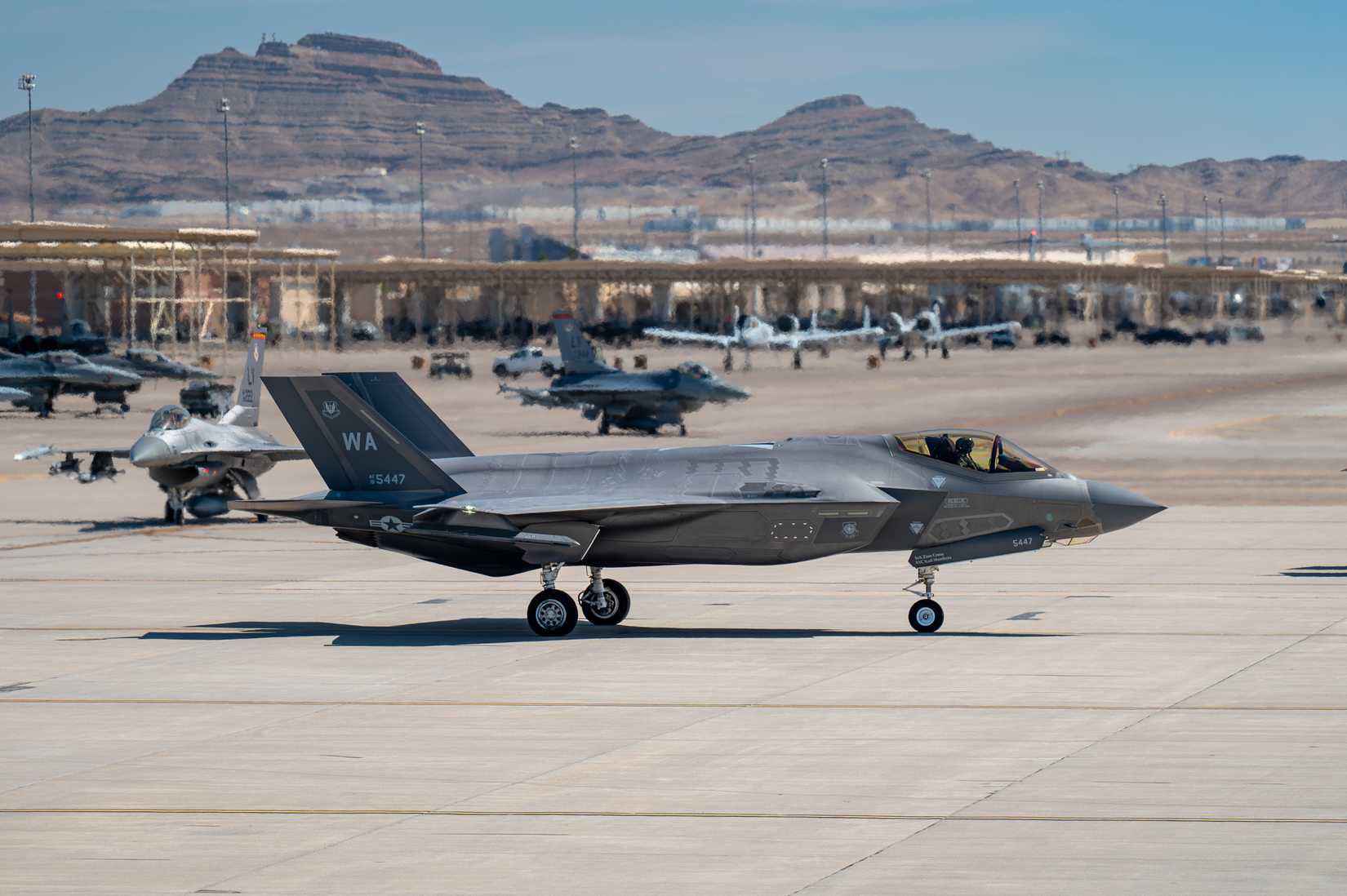 Air Force F-35A Lightning II taxis out for a mission during the U.S. Air Force Weapons School Integration (WSINT) exercise at Nellis Air Force Base, Nevada, June 10, 2025.