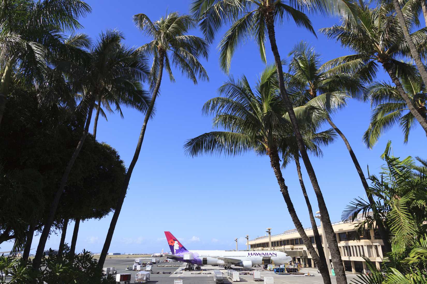 Airplane of Hawaiian Airlines stops in Daniel K. Inouye International Airport.