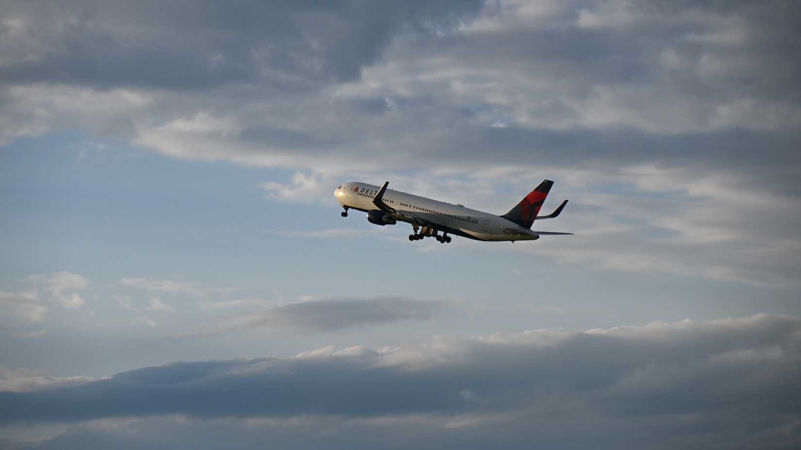 Delta Air Lines Boeing 767-332(ER) (N174DN) retracting its landing gear shortly after takeoff from Prague Airport