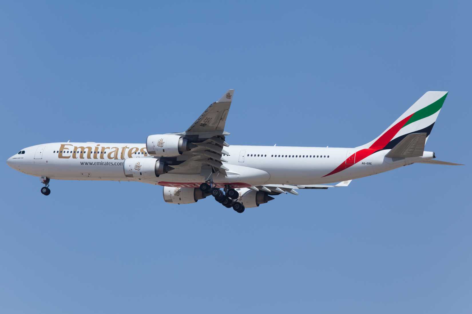 Emirates Airbus A340 landing at DXB shutterstock_261047927