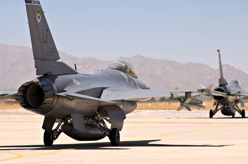 F-16 fighter jets taxi before taking off at Luke Air Force Base