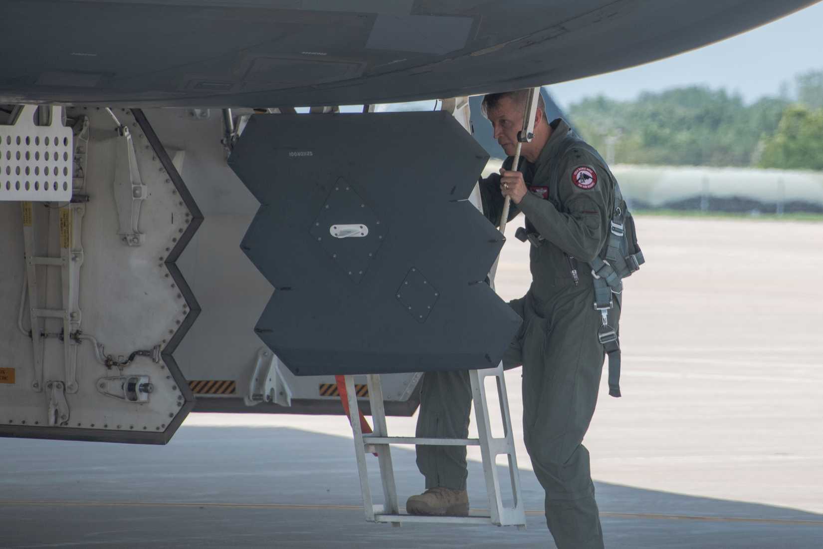 Gen. Daniel R. Hokanson, 29th Chief of the National Guard Bureau, ascends to the cockpit of a B-2 Spirit.