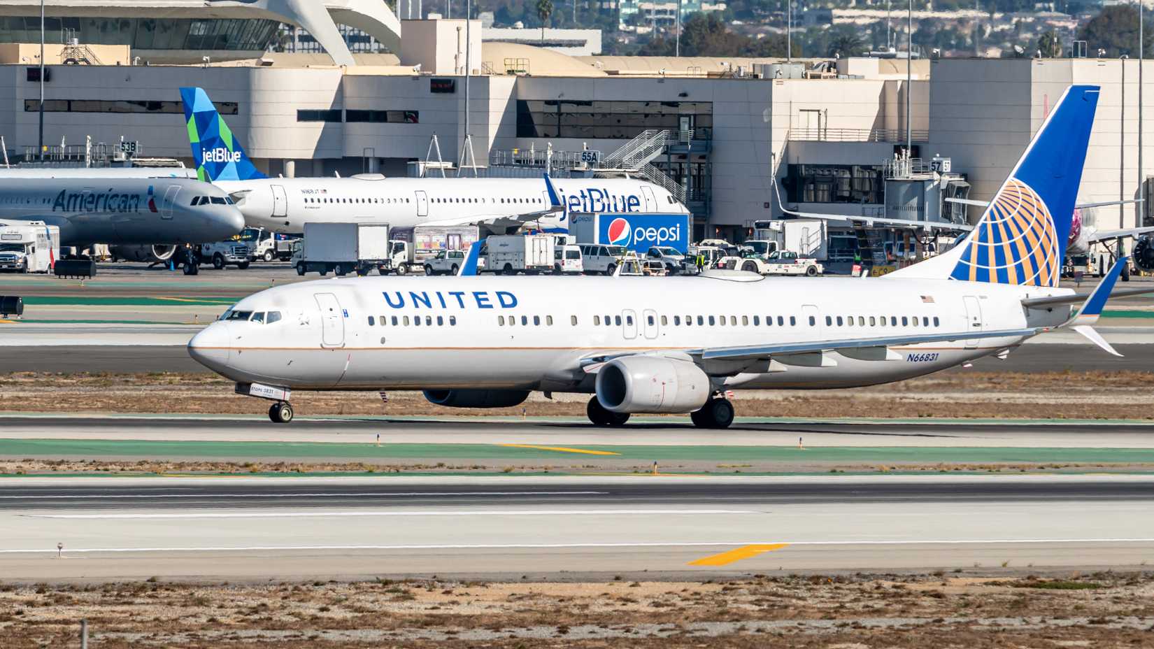 JetBlue and United Airlines aircraft at LAX shutterstock_1654938118
