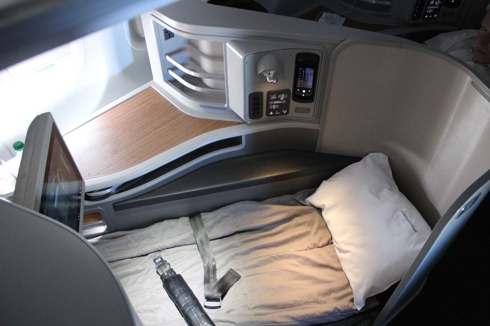 American Airlines flight AA2 prepares to welcome first class passengers in its exclusive Flagship First A321T cabin where fully-flat beds await.