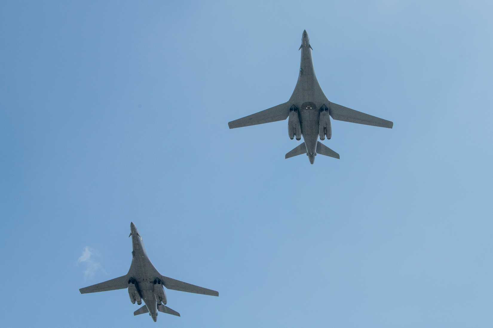 Two U.S. Air Force B-1 Lancers fly over the flightline at Osan Air Base, Republic of Korea, April 15, 2025.