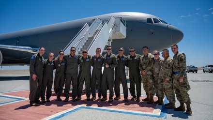 U.S. Airmen assigned to the 60th Air Mobility Wing pose for a photo beside a newly acquired KC-46A Pegasus on the flightline at Travis Air Force Base, California, June 13, 2025.