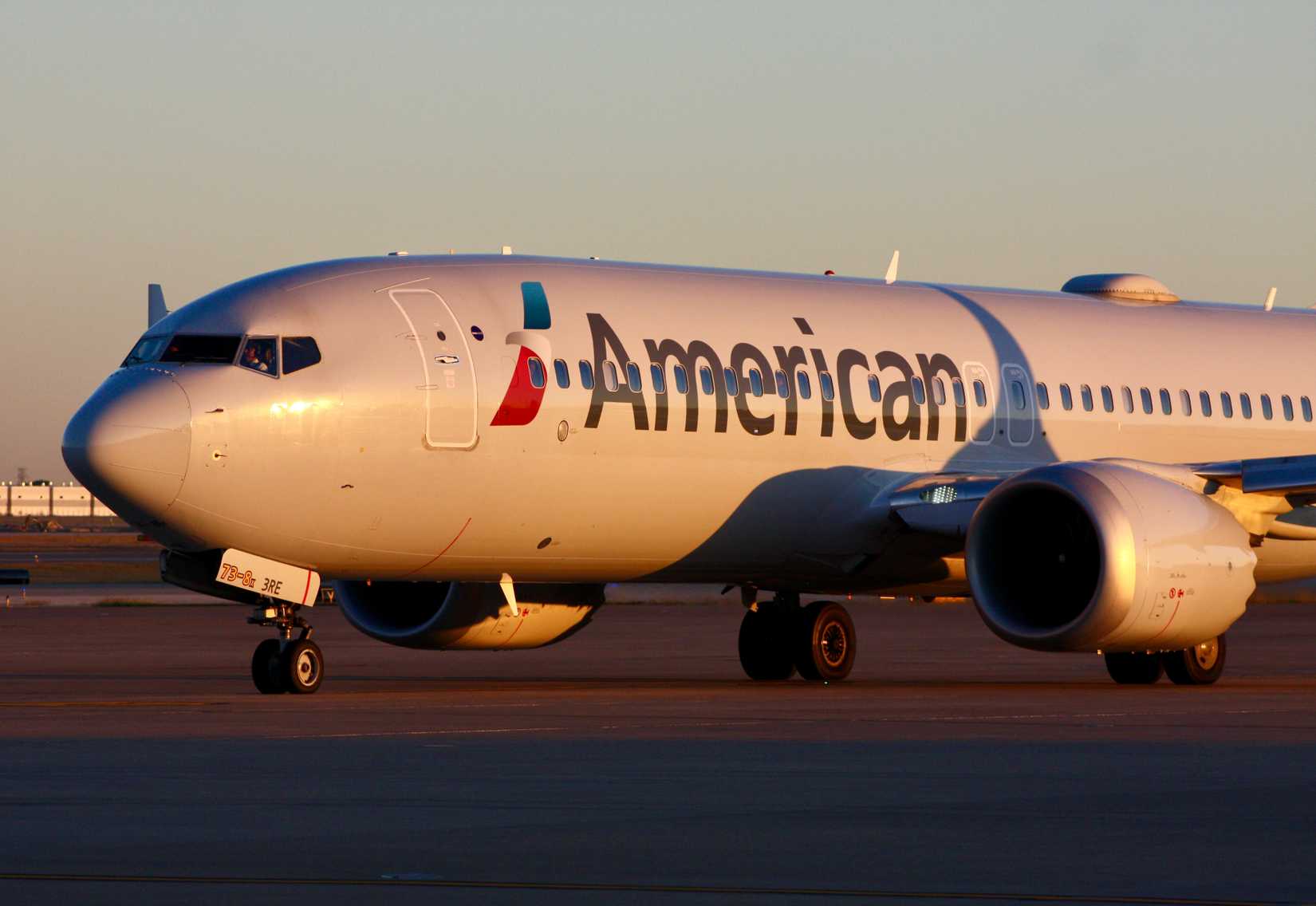 A Boeing 737 MAX 8 of American Airlines taxiing at Dallas Fort Worth International Airport.