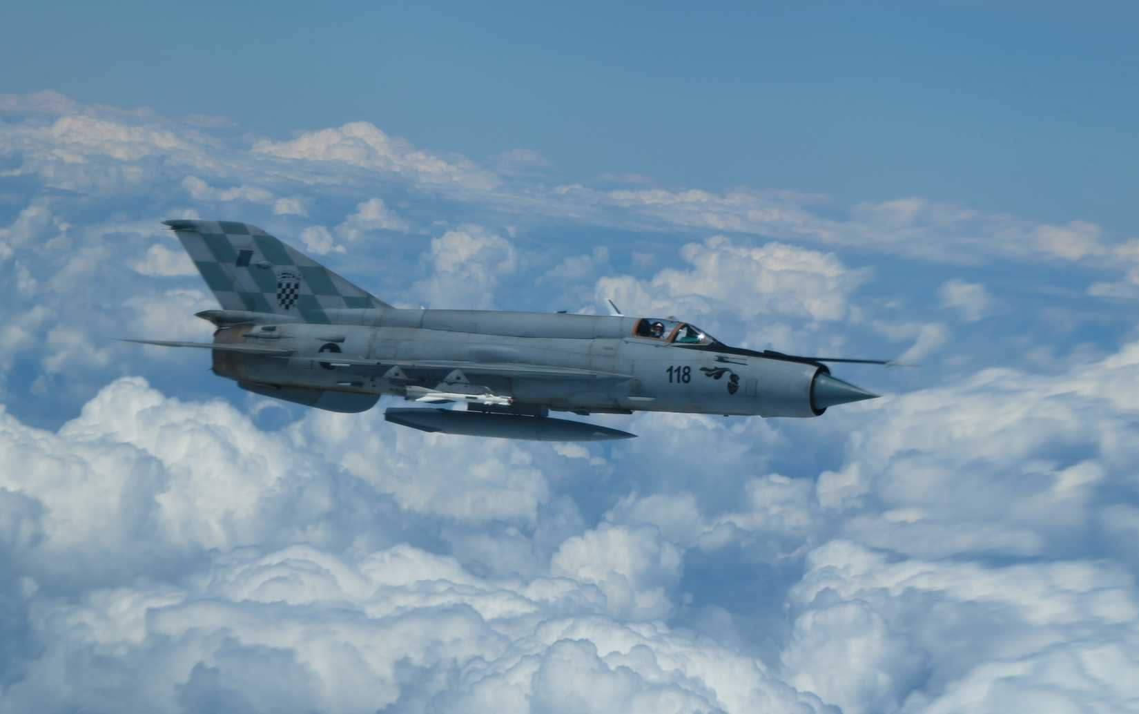A Croatian Air Force MiG-21 integrates with a B-52H Stratofortress, assigned to the 2nd Bomb Wing, Barksdale Air Force Base. 2021.-1