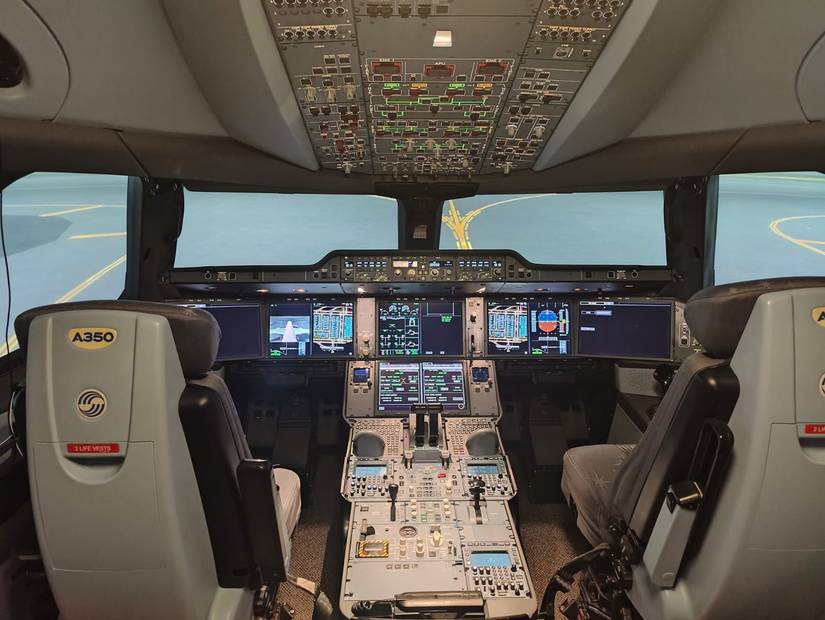 An A350-900 simulator used by Finnair parked at Hong Kong Airport.