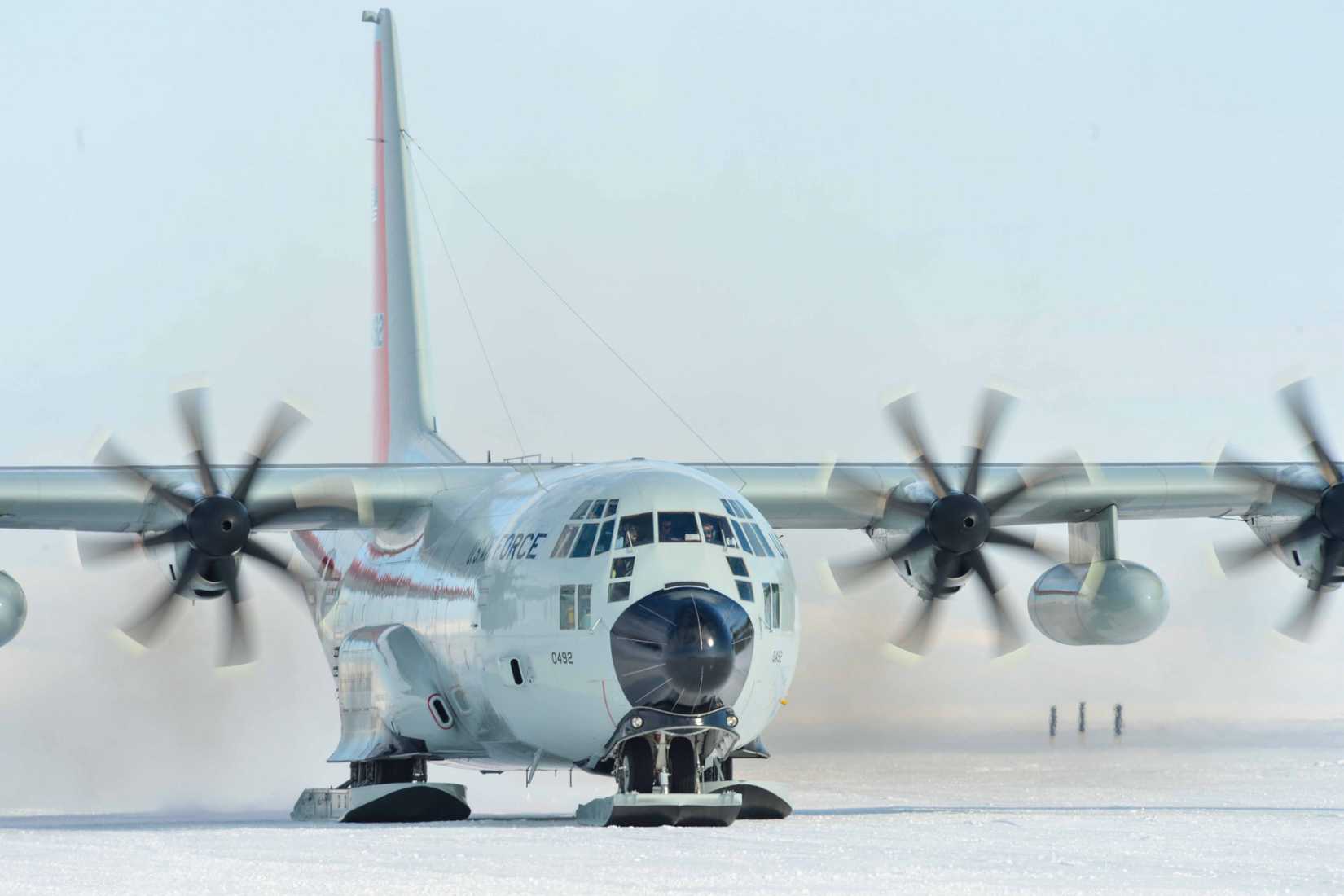 A_ski-equipped_Hercules_aircraft_taxis_along_a_compacted_snow_ice_runway_at_McMurdo_Station,_Antarctica,_Feb._4,_2023