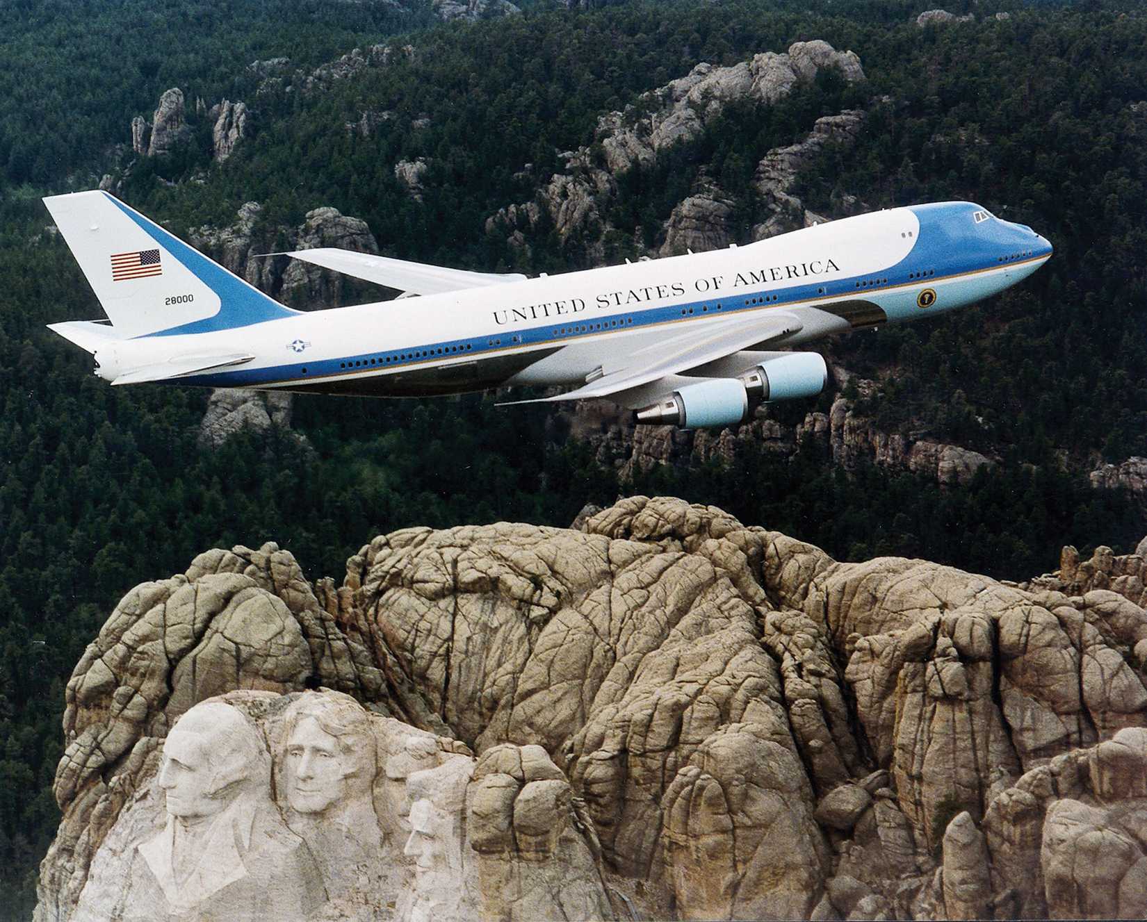 Air Force One of the President of the United States of America, flying over Mount Rushmore.
