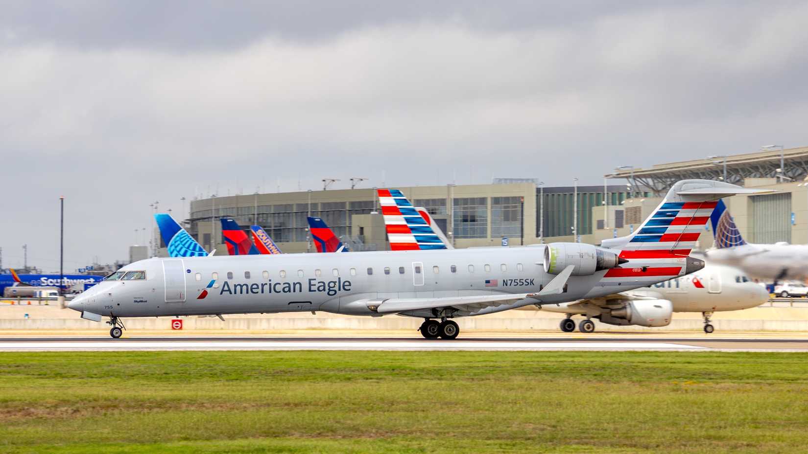 American Eagle Mitsubishi CRJ-701ER departing runway 18L at Austin Bergstrom International Airport.