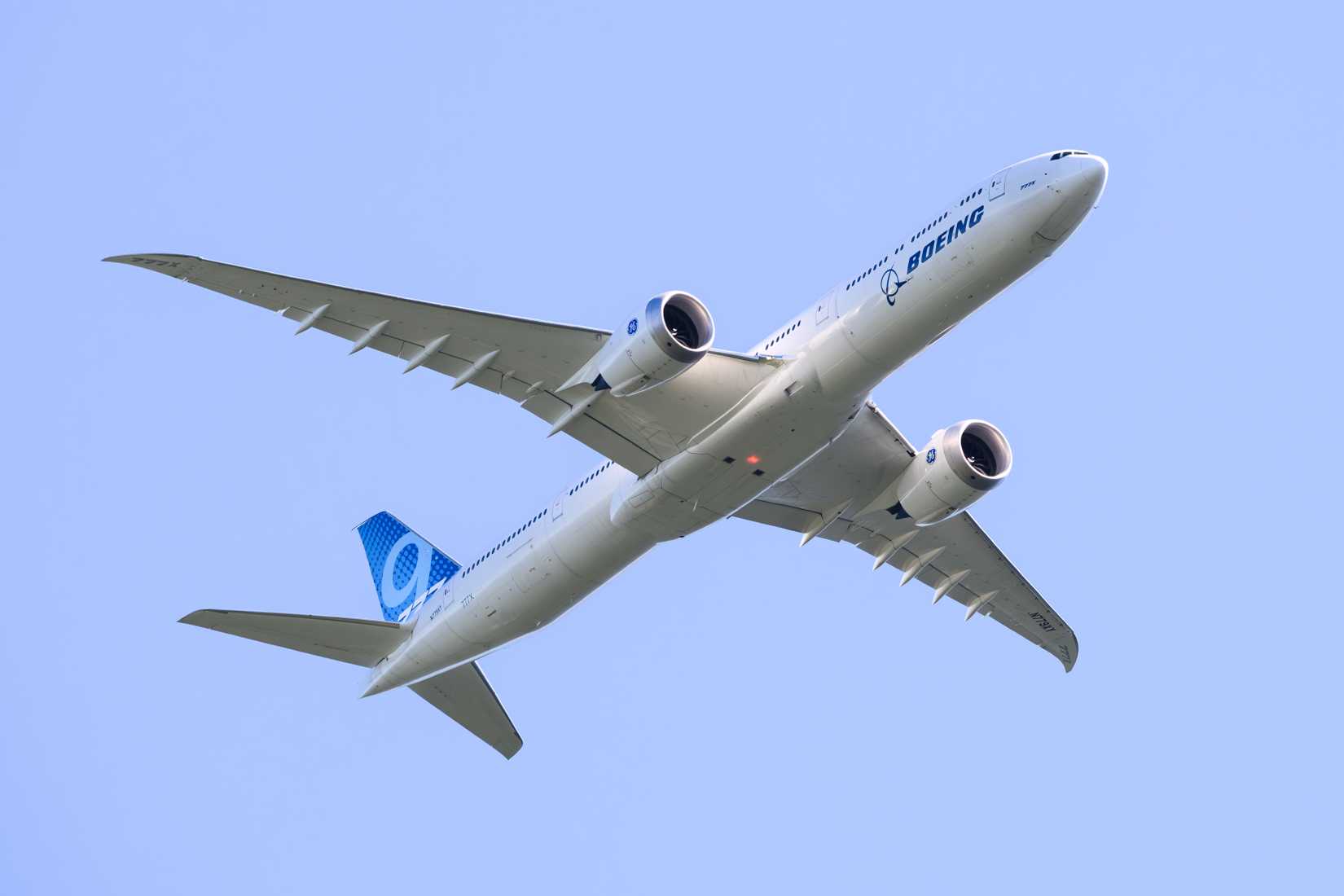 Boeing 777-9 test aircraft registration N779XY from below in Boeing corporate livery a 777X passenger jet.
