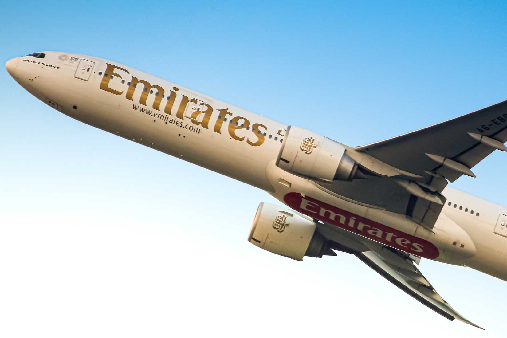 Emirates Airlines B777-300ER registered as A6-EBO departure at sunset