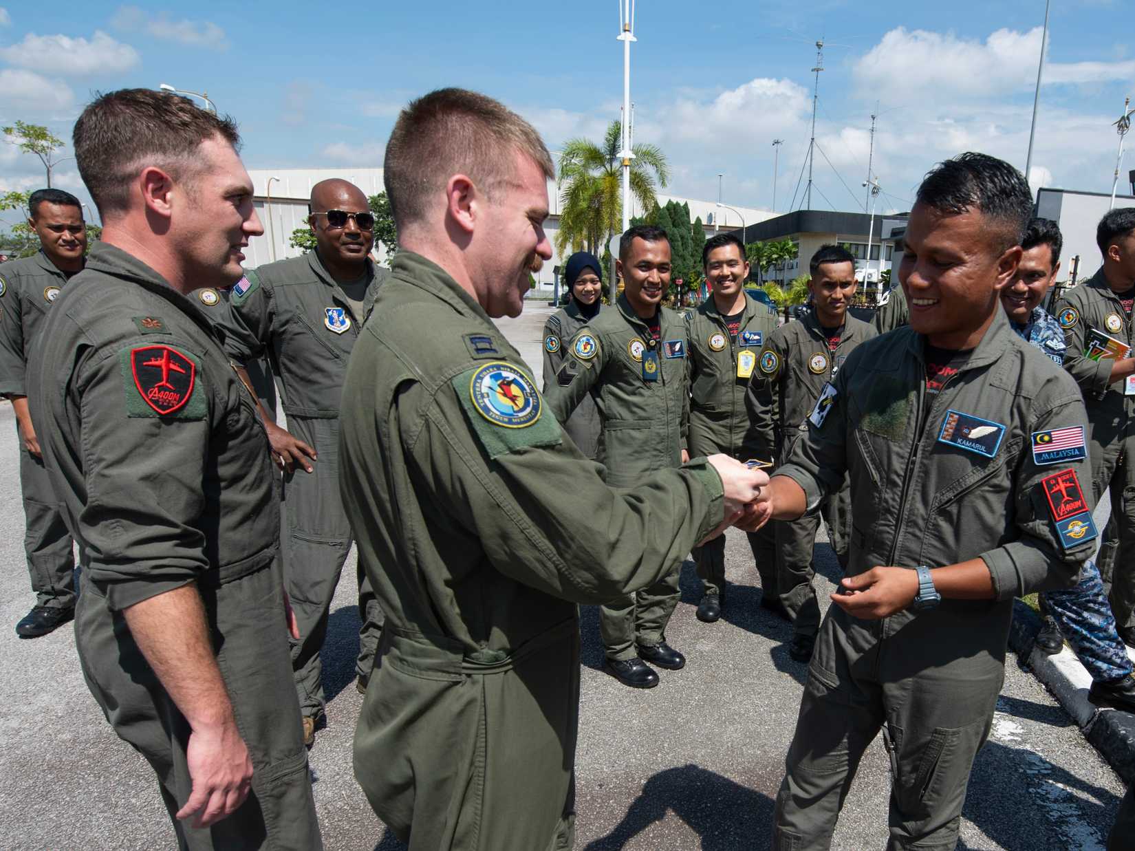 Pilots and Aircrew from the 141st Air Refueling Wing, Washington Air National Guard and Royal Malaysian Air Force exchange patches during an academics day November 12, 2024 at Subang Air Base, Malaysia.