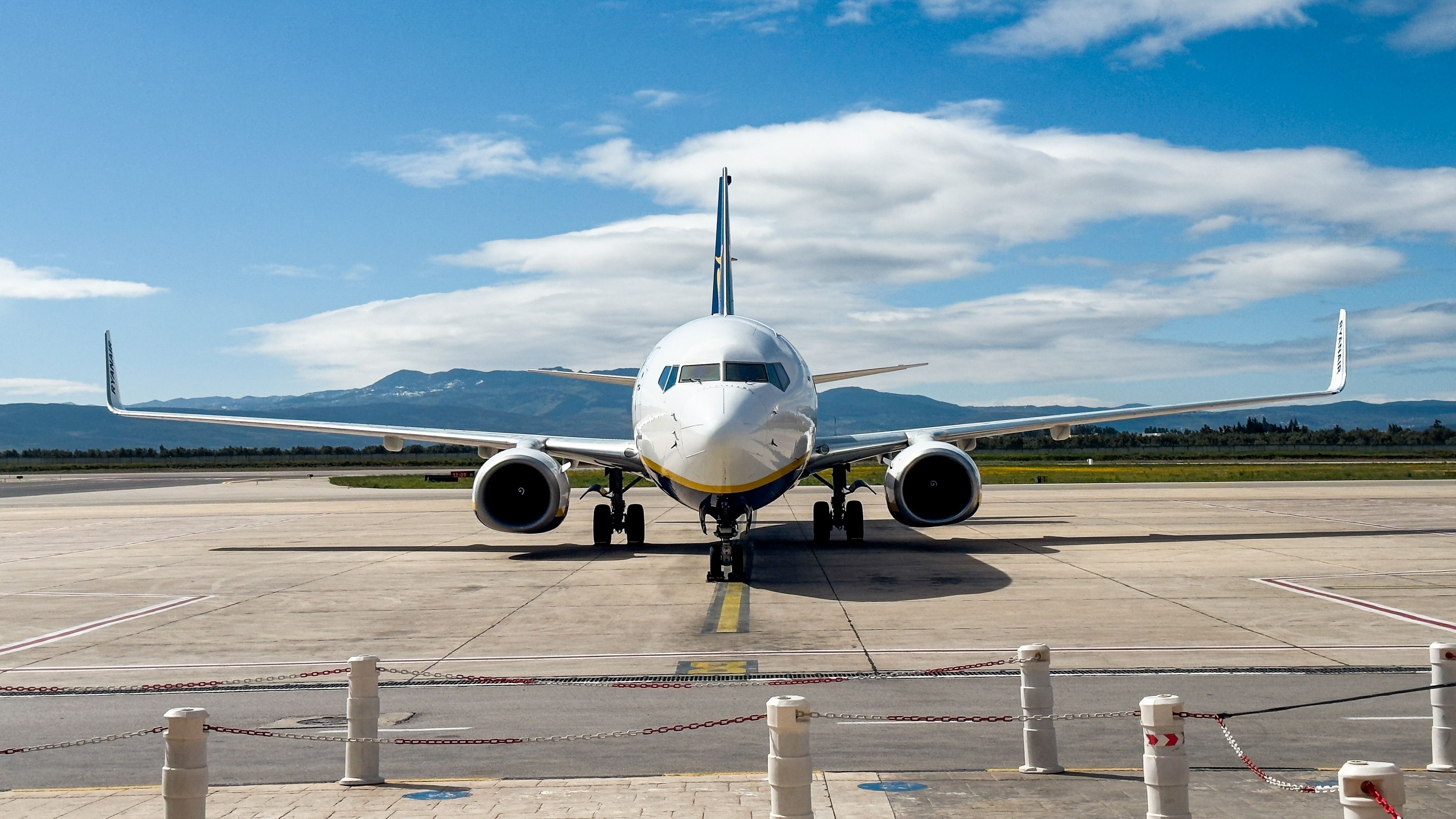 A Ryanair Boeing 737 parked at a gate area
