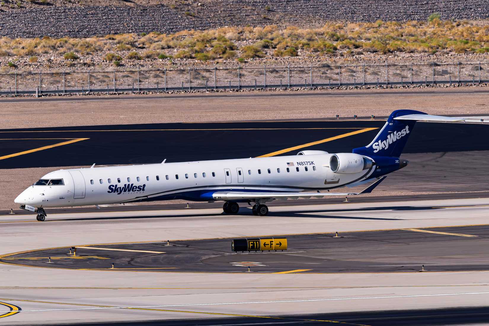Skywest Airlines Bombardier CR9700 N817SK arrival on runway 7R at Phoenix Sky Harbor.