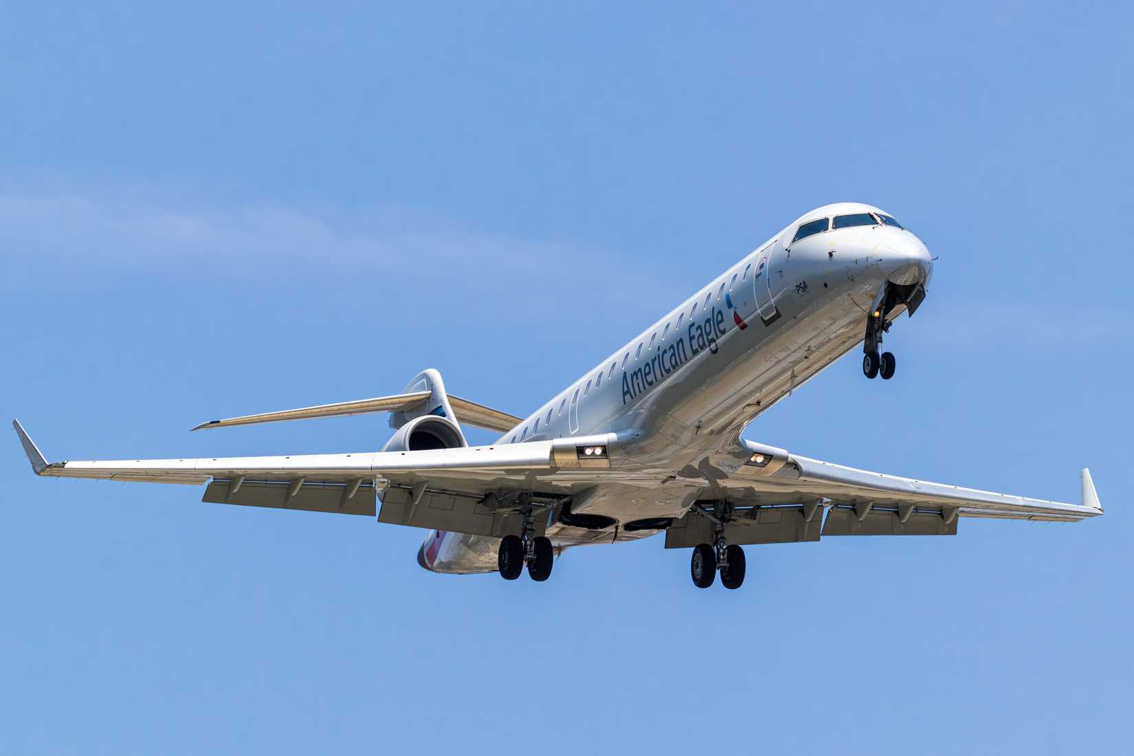 The PSA Airlines American Eagle CRJ-700 flying over Charlotte, NC.