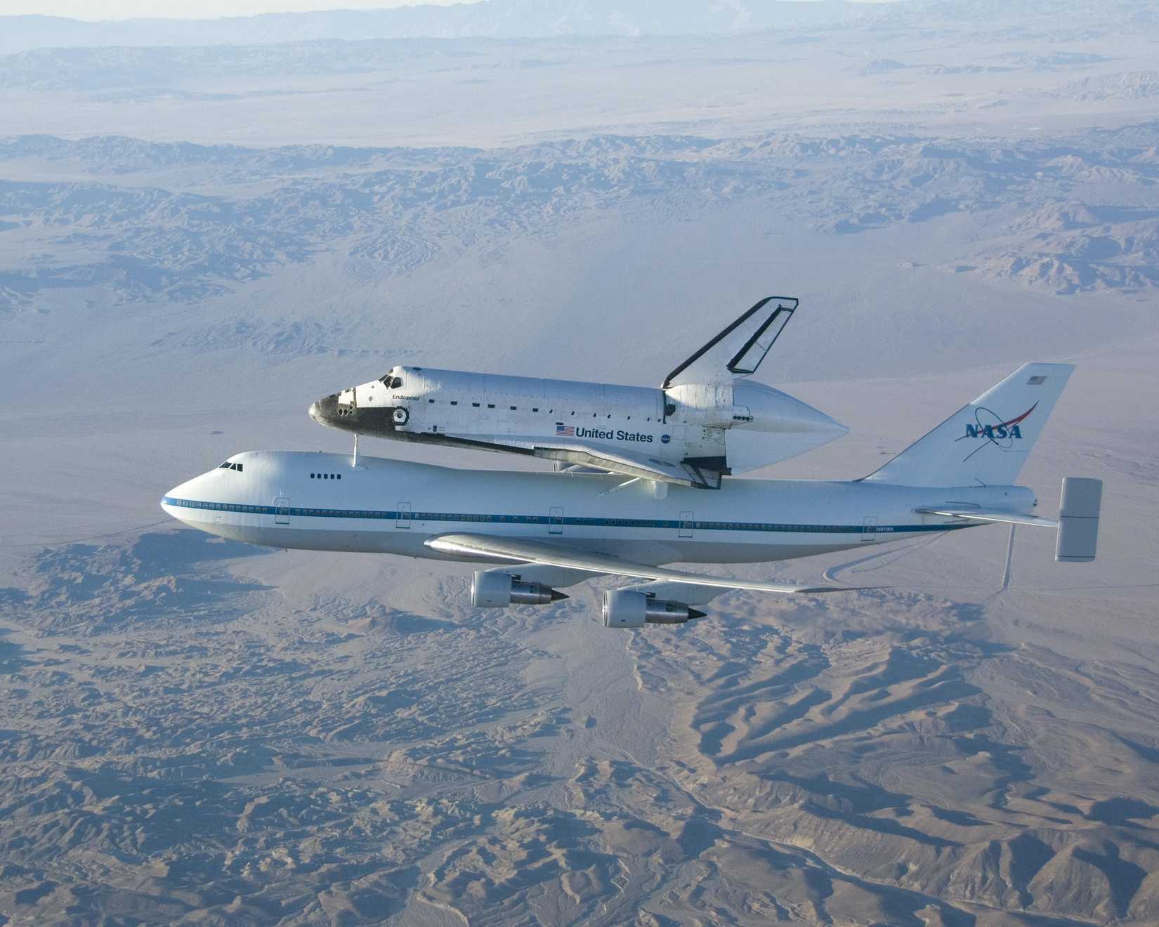 The Space Shuttle Endeavour mounted atop its modified Boeing 747 carrier aircraft flies over California's Mojave Desert on the first leg of its ferry flight back to the Kennedy Space Center on Dec. 10, 2008.