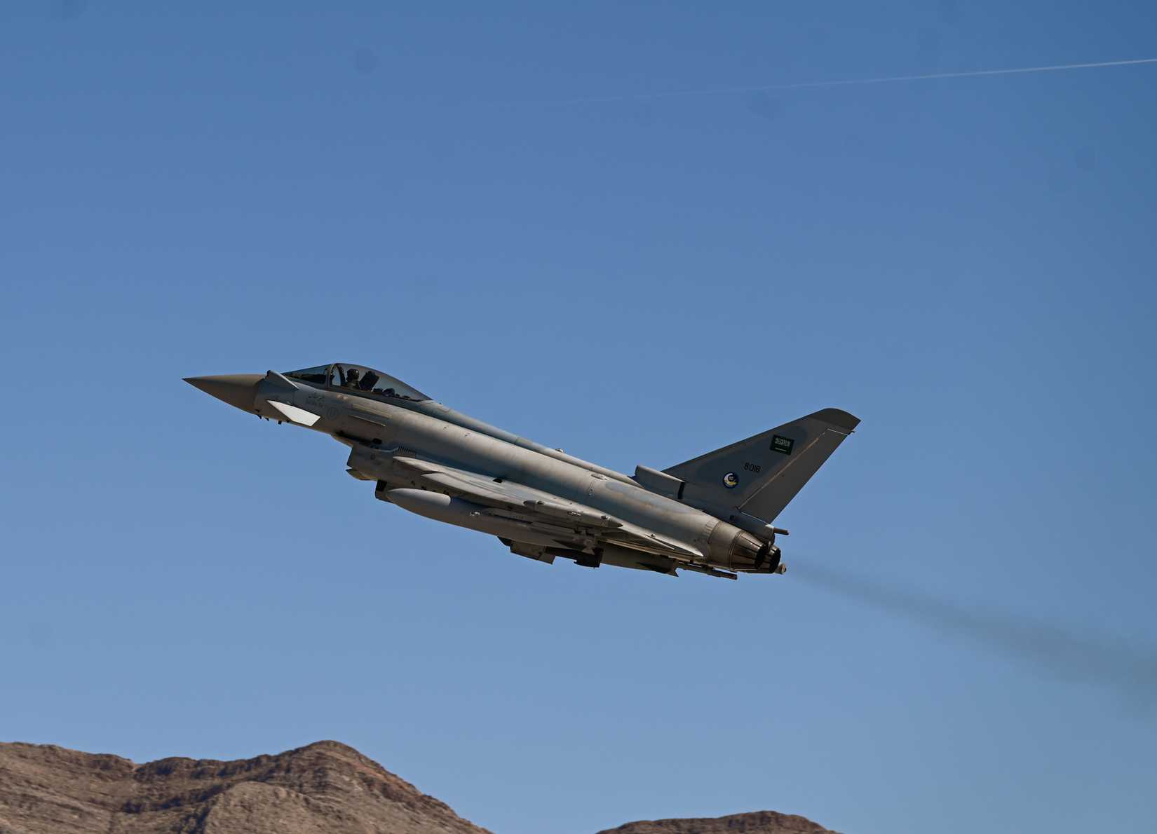 A Royal Saudi Air Force Eurofighter Typhoon climbs into the Nevada sky during Red Flag 25-2.