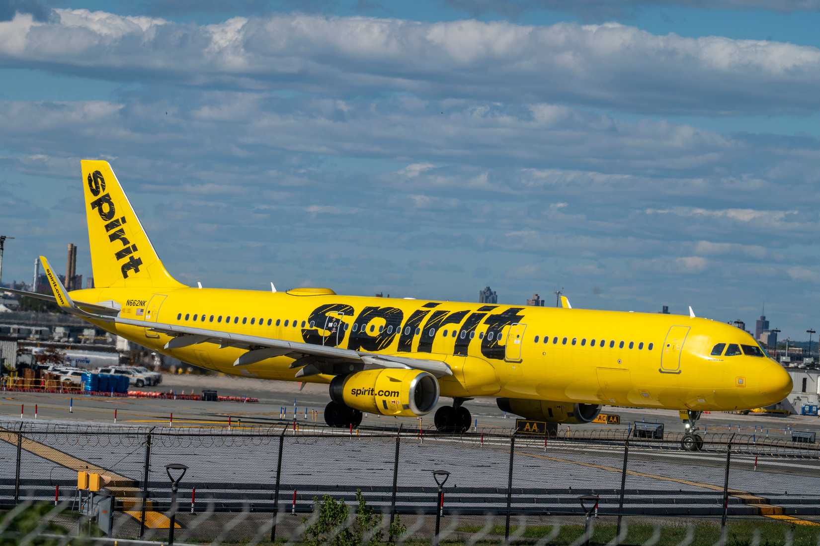 A Spirit Airlines Airbus A321-231 tail number N662NK airplane taxiing to runway for takeoff at LaGuardia Airport.