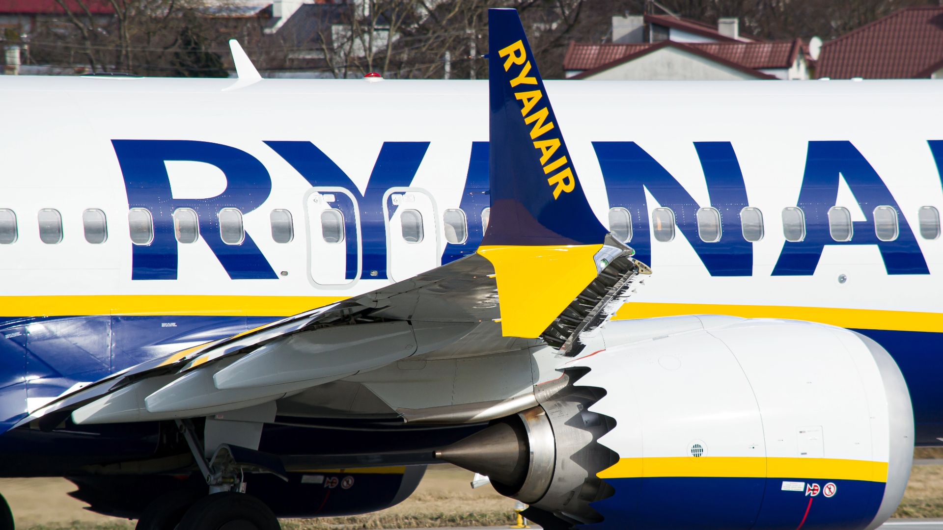 Close-up photo of Ryanair Boeing 737 MAX 8-200 aircraft's split scimitar winglet and engine