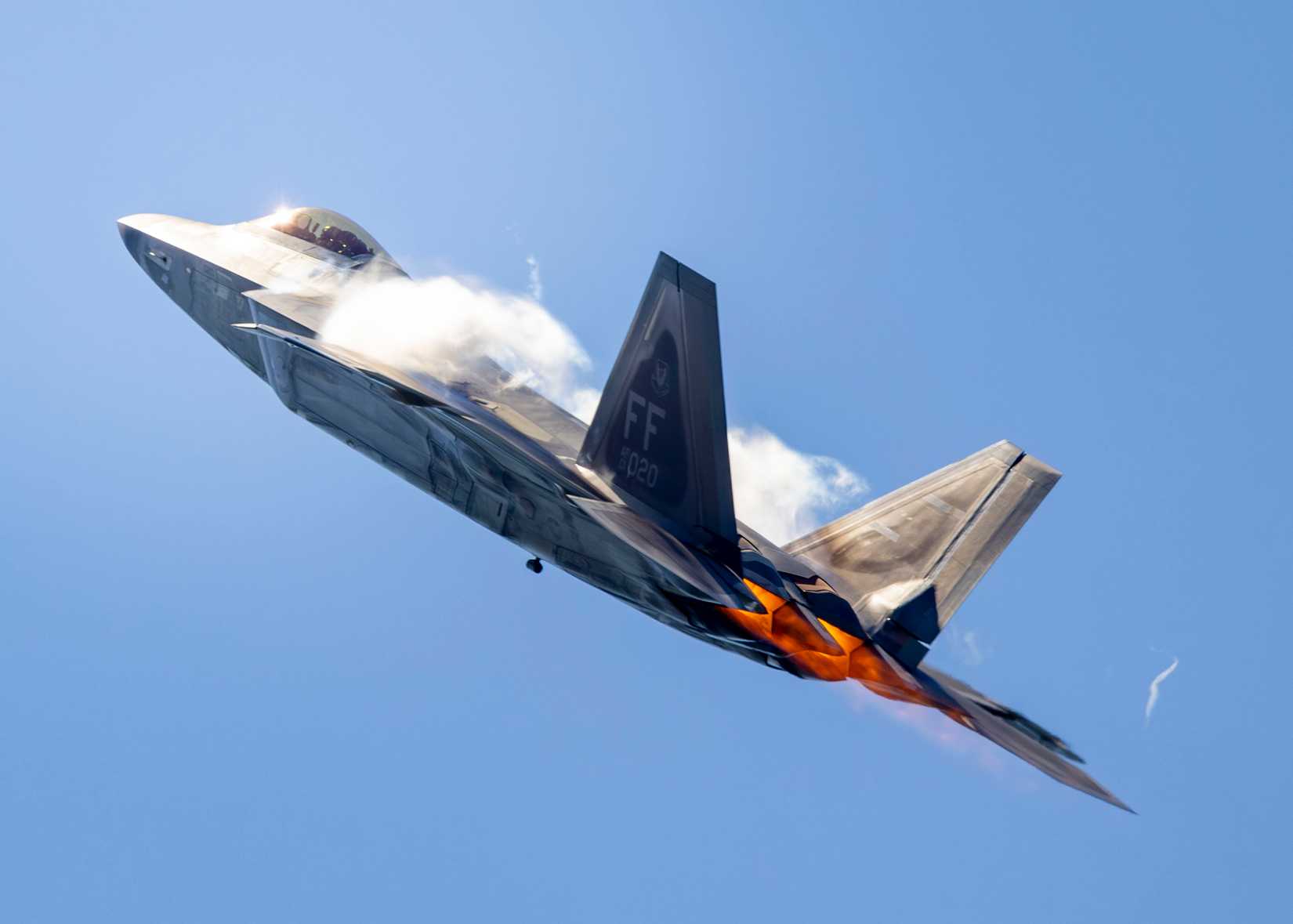 Afterburners are lit as an F-22 Raptor performs an aerial demonstration at the New York Air Show.