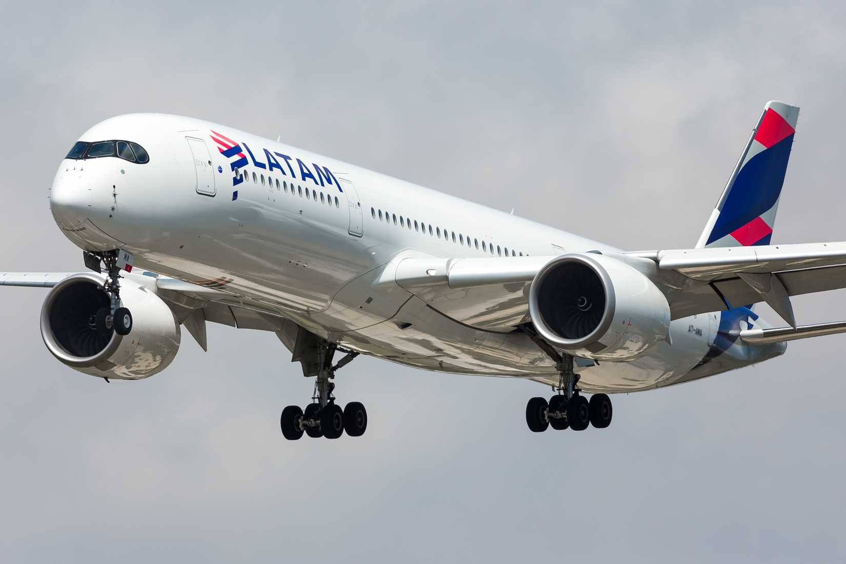 Airbus A350-900 A7-AMA civil airliner of Latam Airlines landing at El Prat international airport.