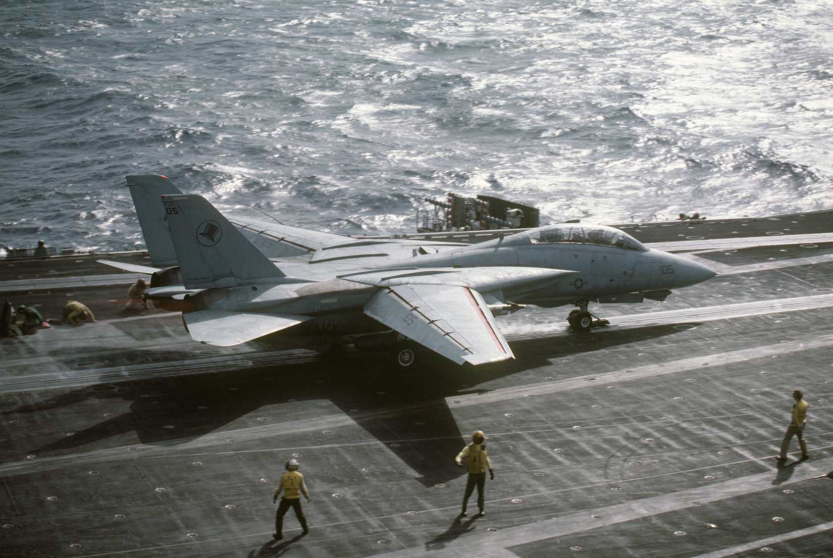 An F-14A Tomcat aircraft from Fighter Squadron 14 (VF-14) is launched from the aircraft carrier USS JOHN F. KENNEDY (CV 67)
