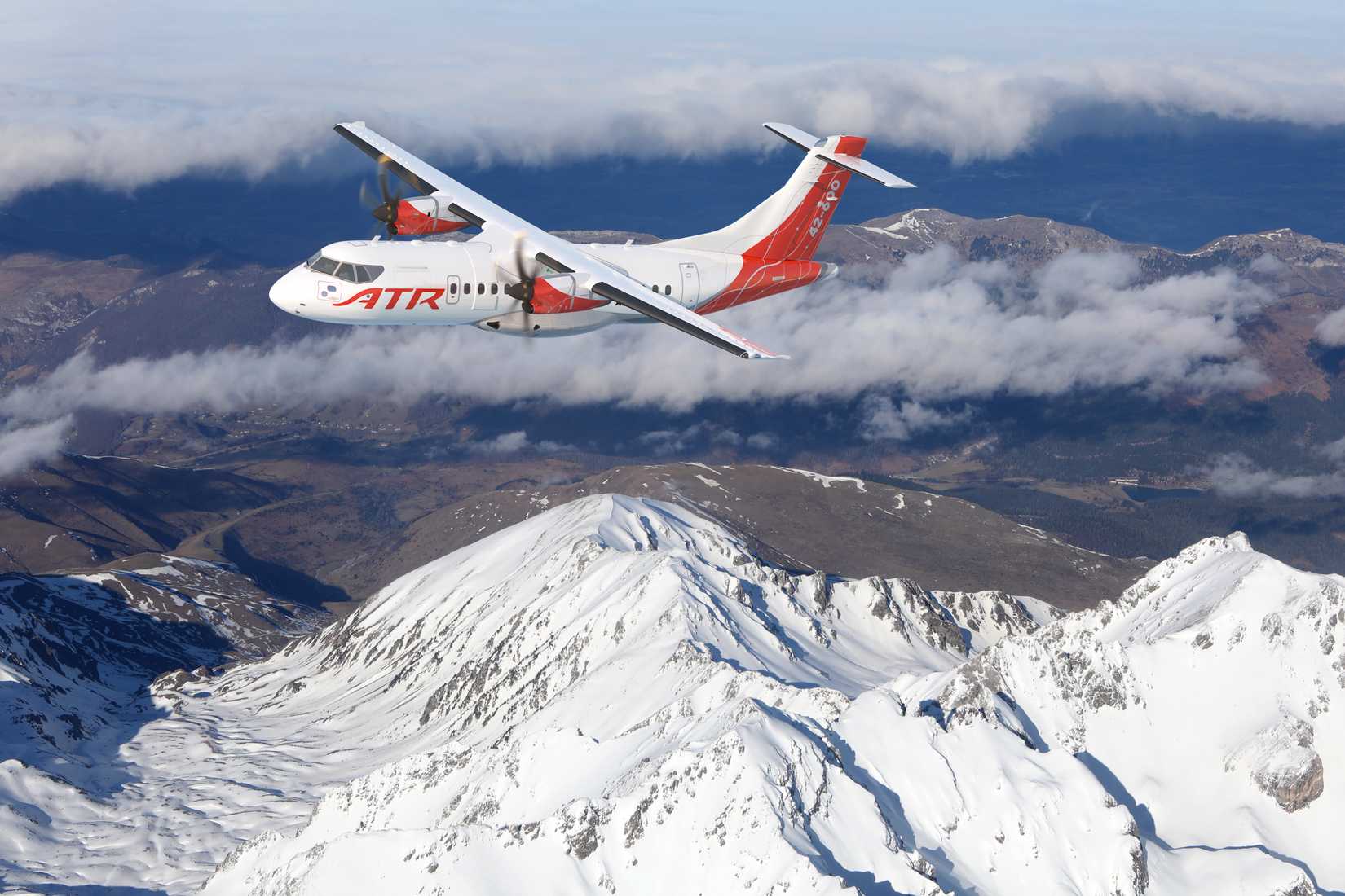 ATR42-600 flying over mountains