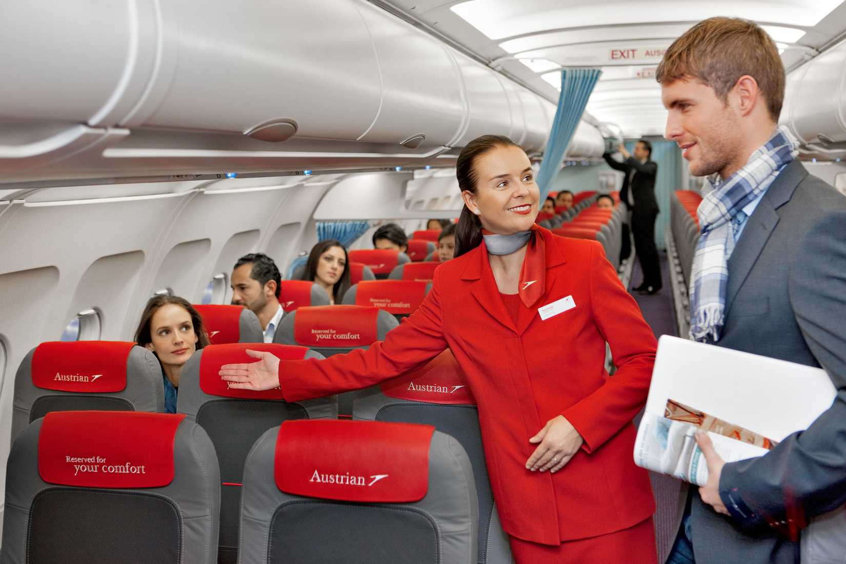 Austrian_Airlines_flight_attendant_and_passenger (1)