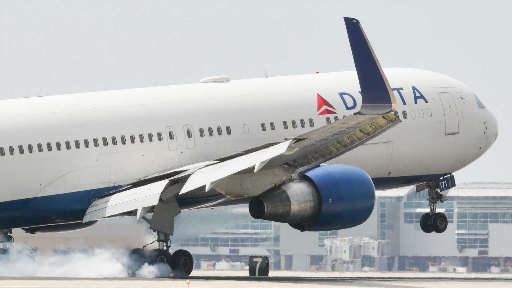 Delta Air Lines Boeing 767-300ER is touching down on the runway
