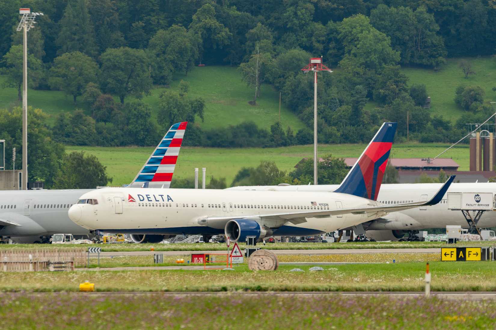 Delta Airlines Boeing 767-322ER aircraft is taxiing to its position.
