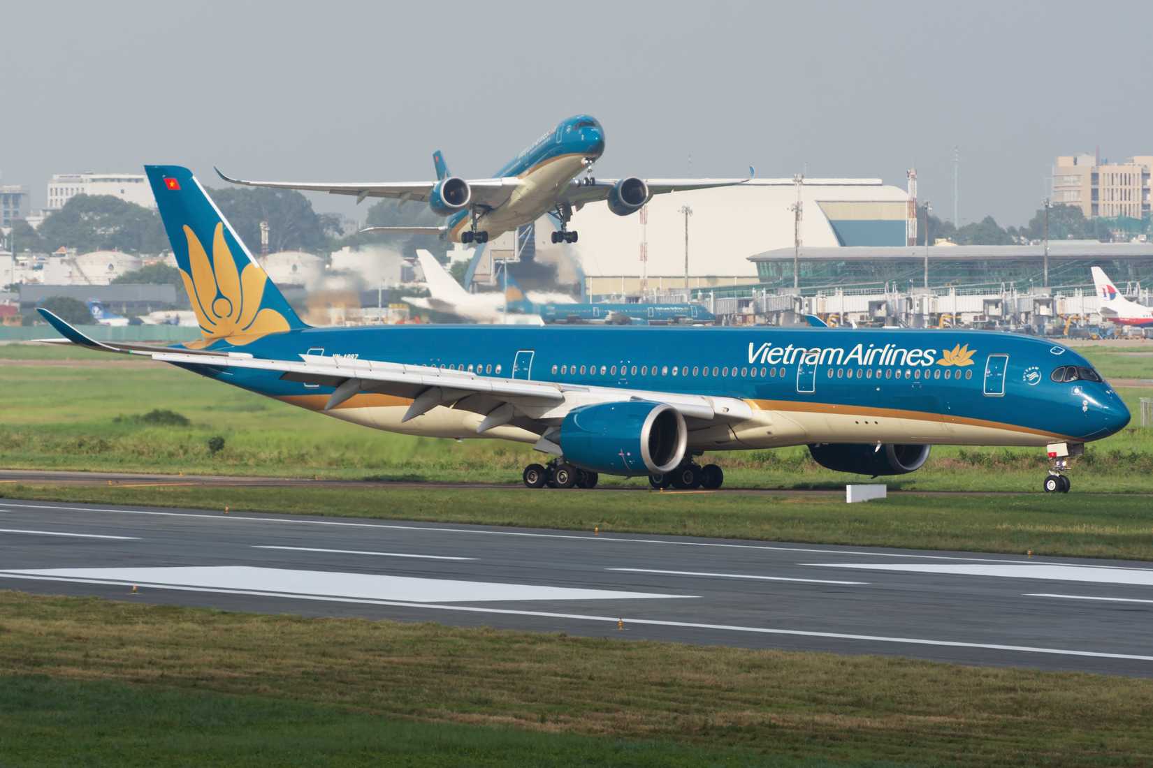 Double Vietnam Airlines Airbus A350-900 XWB in action at Tan Son Nhat Airport.