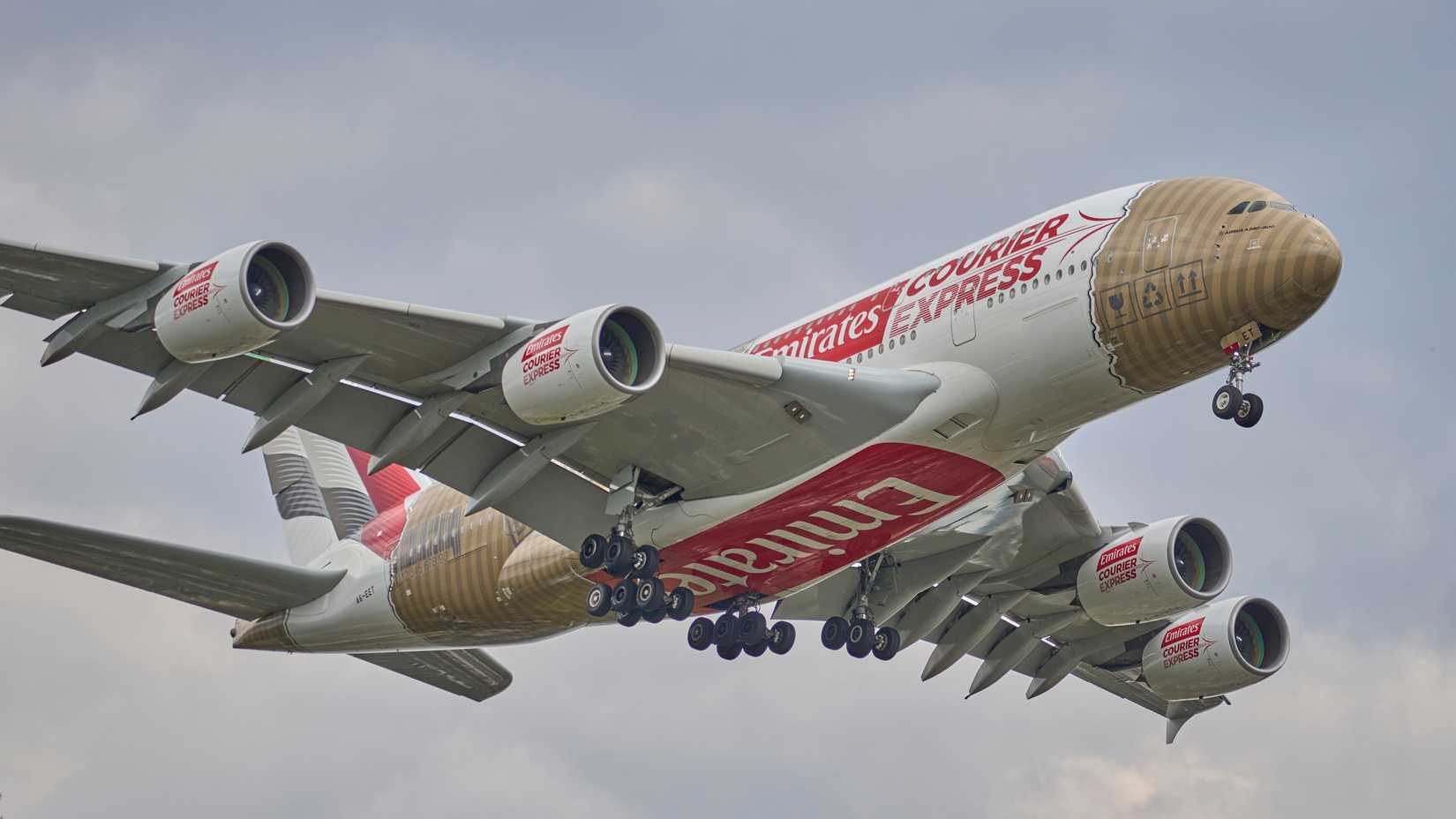 Emirates Special Livery Courier Express Flight EK201 from Dubai (DXB) to New York (KJFK) landing on runway 22L.