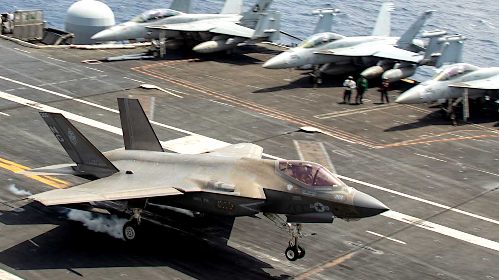     An F-35C Lightning II, attached to Marine Fighter Attack Squadron (VMFA) 314, makes an arrested landing on the flight deck of the Nimitz-class aircraft carrier USS Abraham Lincoln (CVN 72).