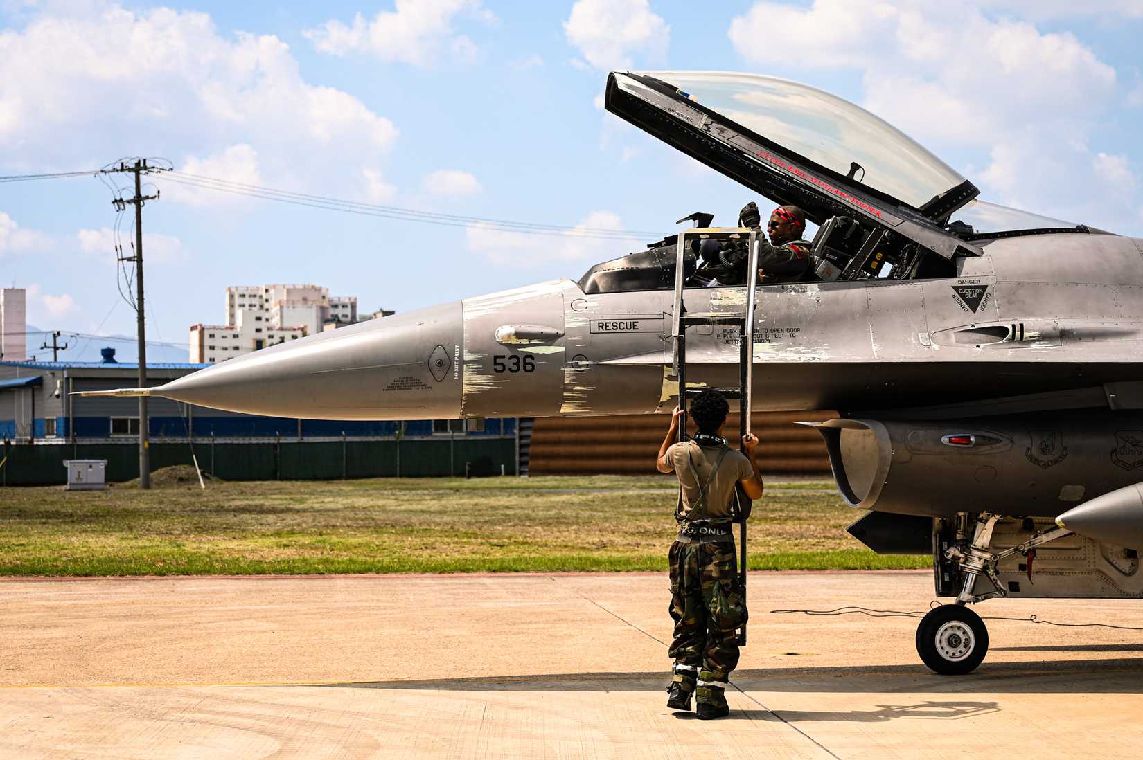 ir Force F-16 Fighting Falcon pilot assigned to the 36th Fighter Squadron prepares to disembark his aircraft.