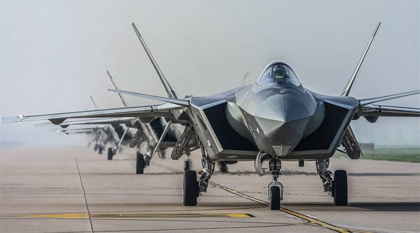 J-20 stealth fighter jets attached to an aviation brigade of the PLA Air Force participate in close formation taxiing known as an elephant walk.