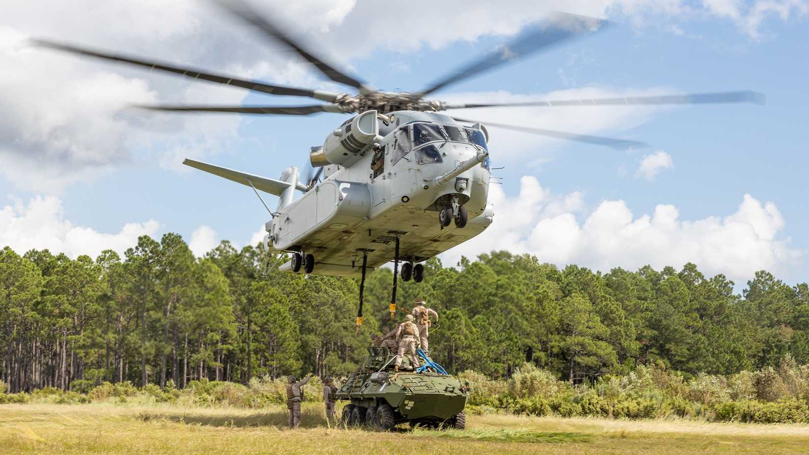 Marines with 2nd Distribution Support Battalion, Combat Logistics Regiment 2, 2nd Marine Logistics Group, prepare to attach a LAV-25mm to a CH-53K King Stallion