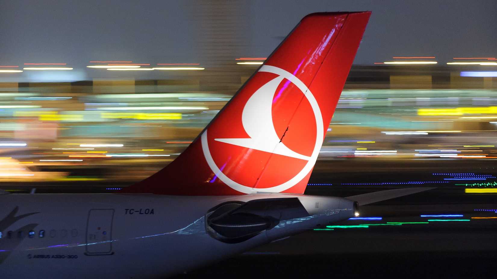 Turkish Airlines tail at night.