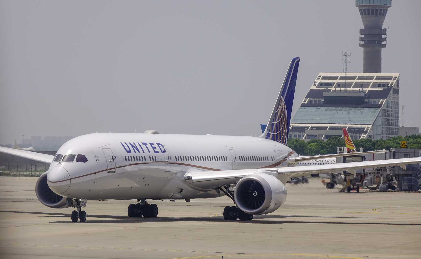 United Airlines Boeing 787-9 Dreamliner taxiing on runway of Shanghai Pudong Airport
